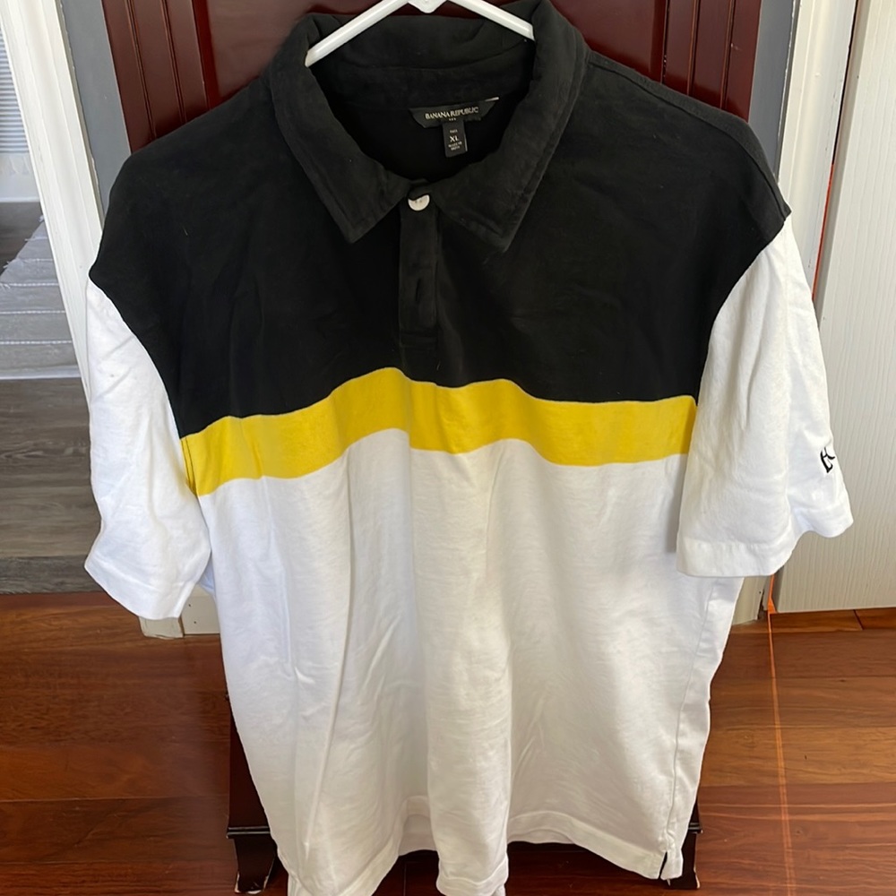 Banana Republic Polo never worn.  Black white and yellow.  Excellent!!  Size XLT